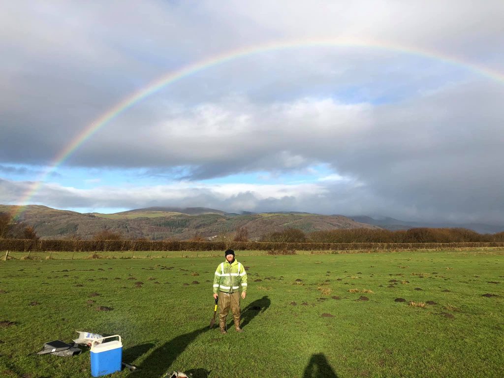 Collecting plant samples on Dyfi Estuary